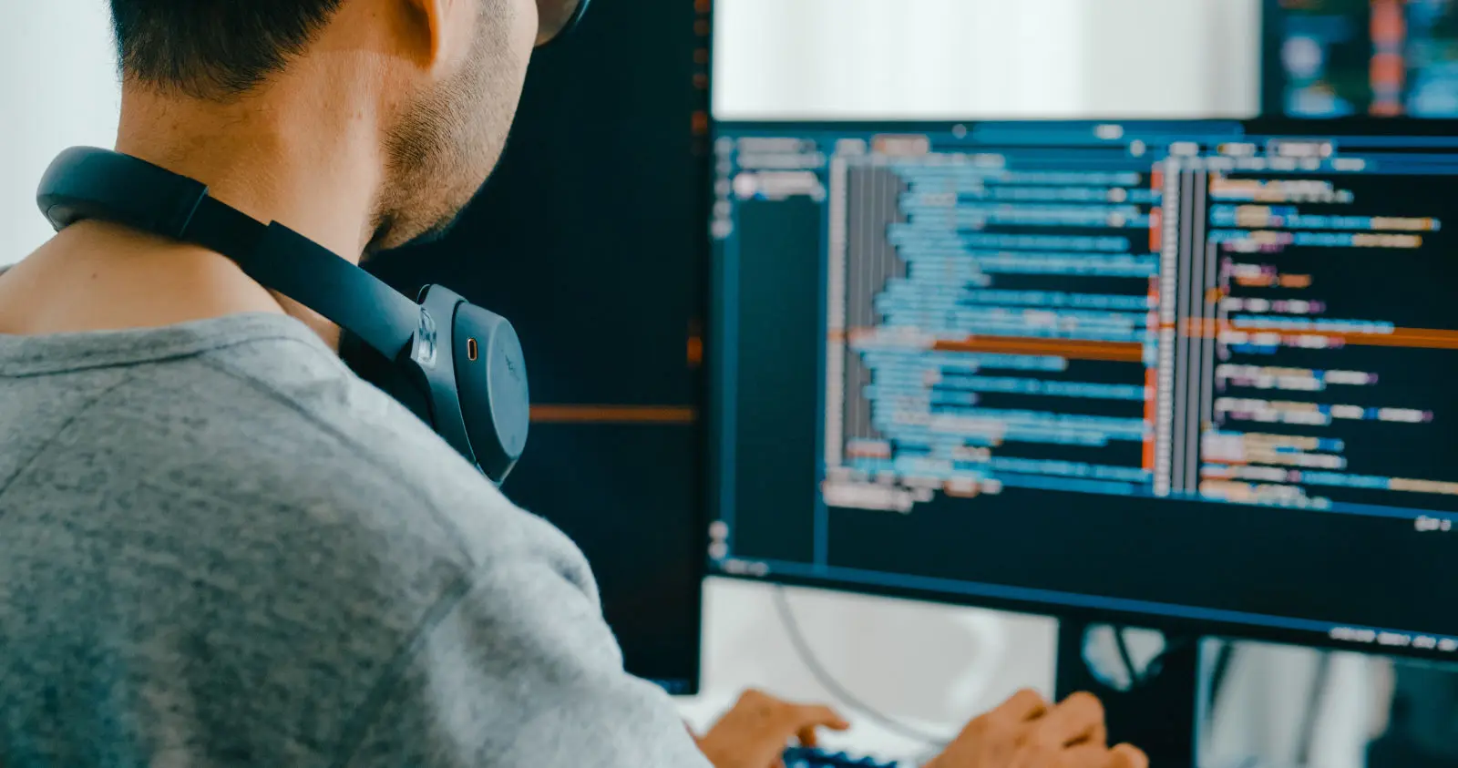 Web developer writing code at W Web Design and Hosting